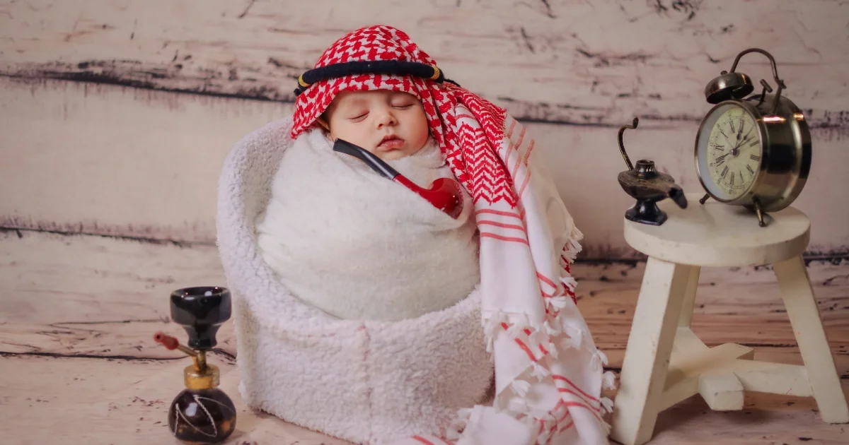 Baby home photoshoot by Indo Frames with creative Arabic theme setup and newborn wrapped pose