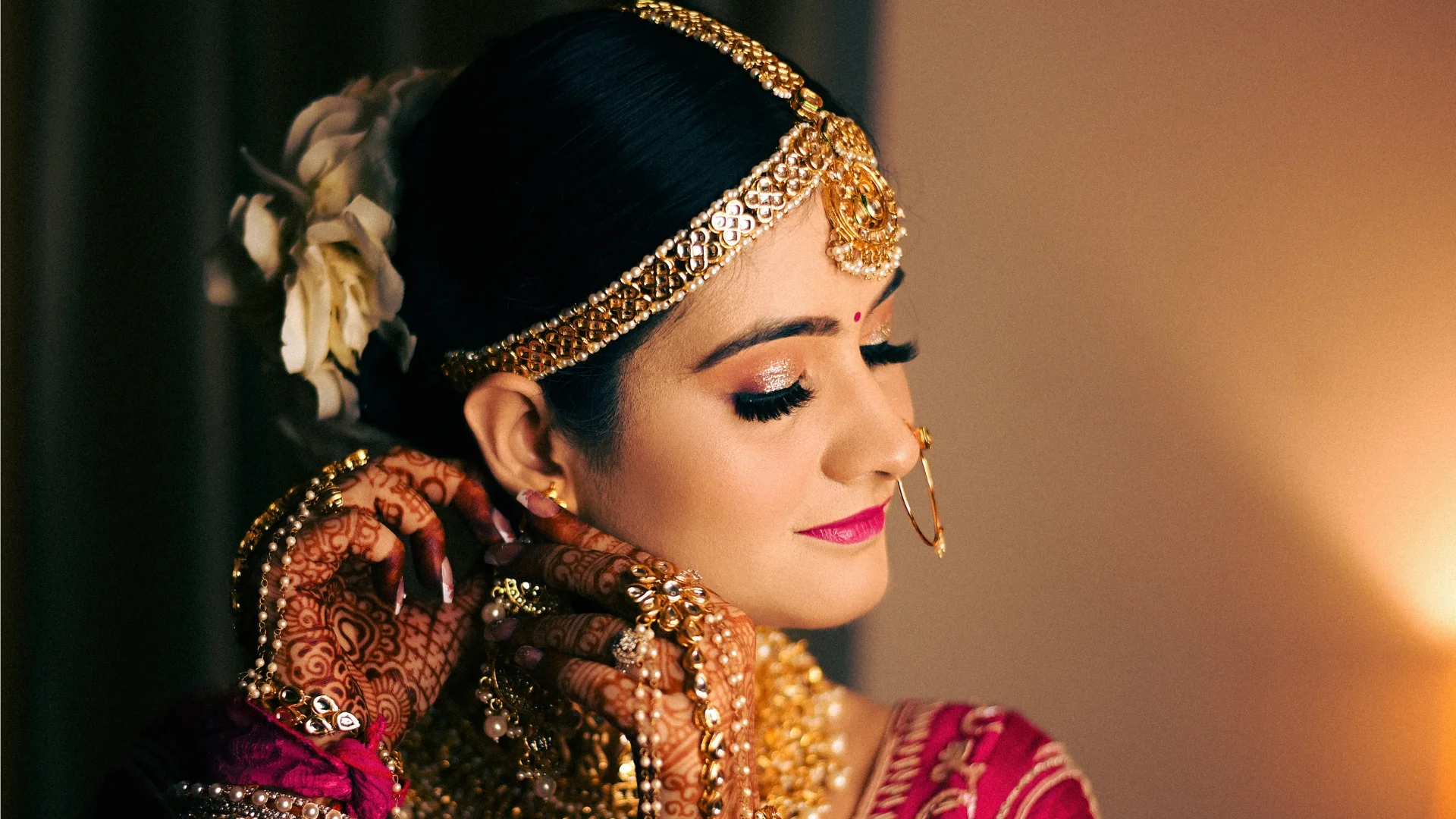 Elegant bridal beauty portrait by Indo Frames, highlighting flawless makeup, jewellery and traditional Indian bridal styling for wedding photography.
