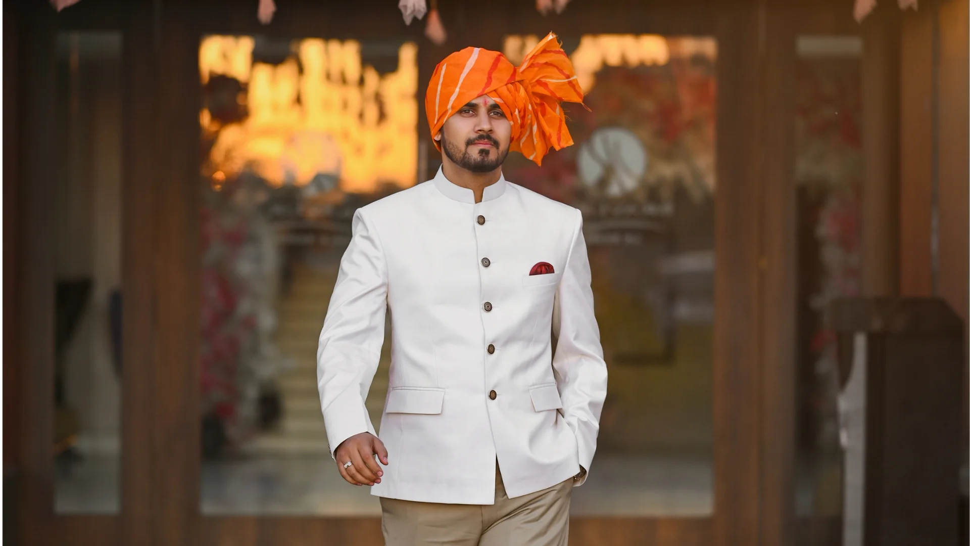 Stylish groom portrait in traditional attire captured by Indo Frames