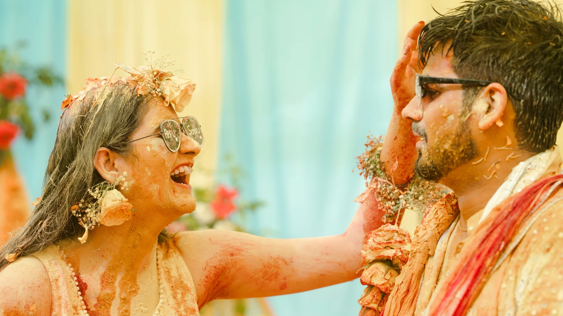 Happy couple enjoying haldi ceremony captured by Indo Frames