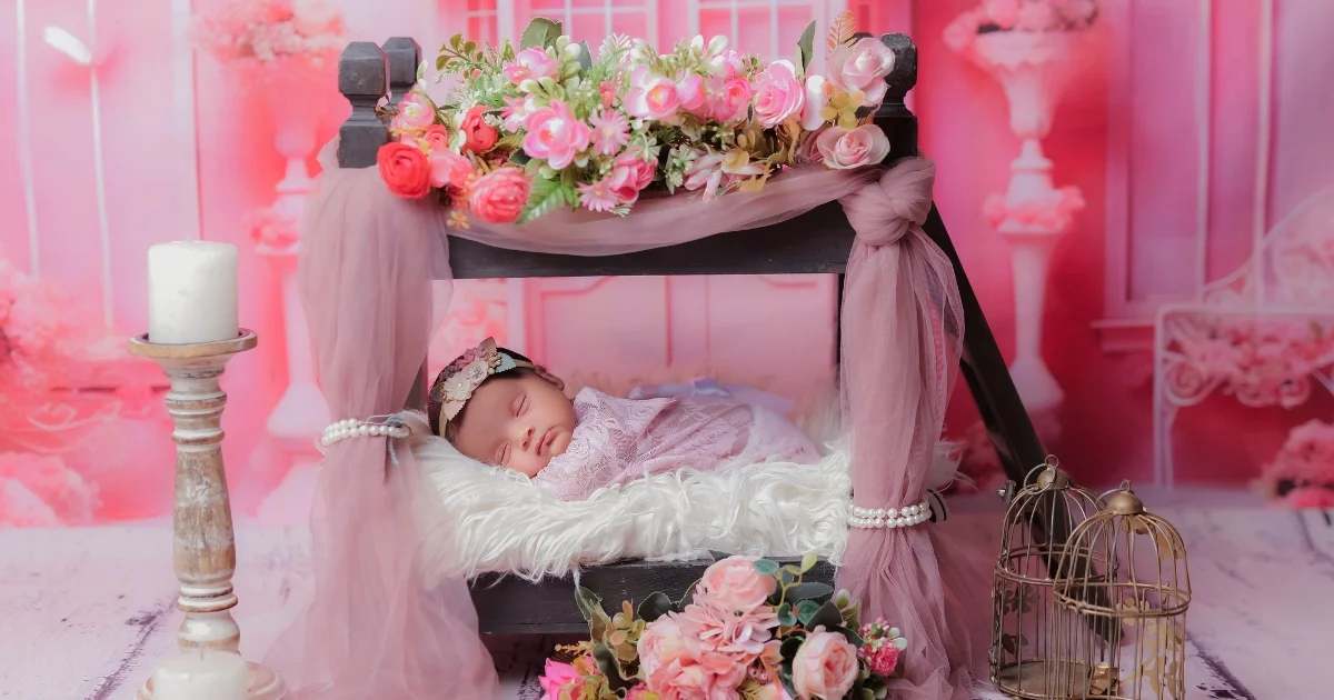 Newborn baby photoshoot by Indo Frames with princess floral theme and pink decorative setup