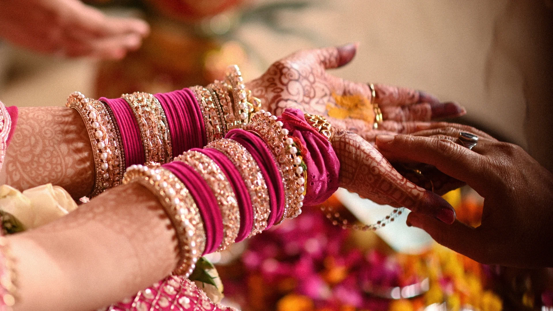 Close-up of bride hands during wedding rituals captured by Indo Frames